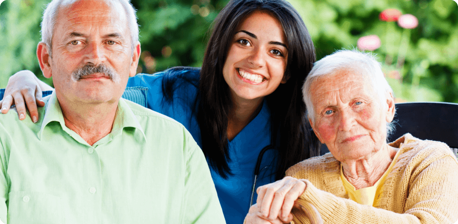 an old couple with their caretaker