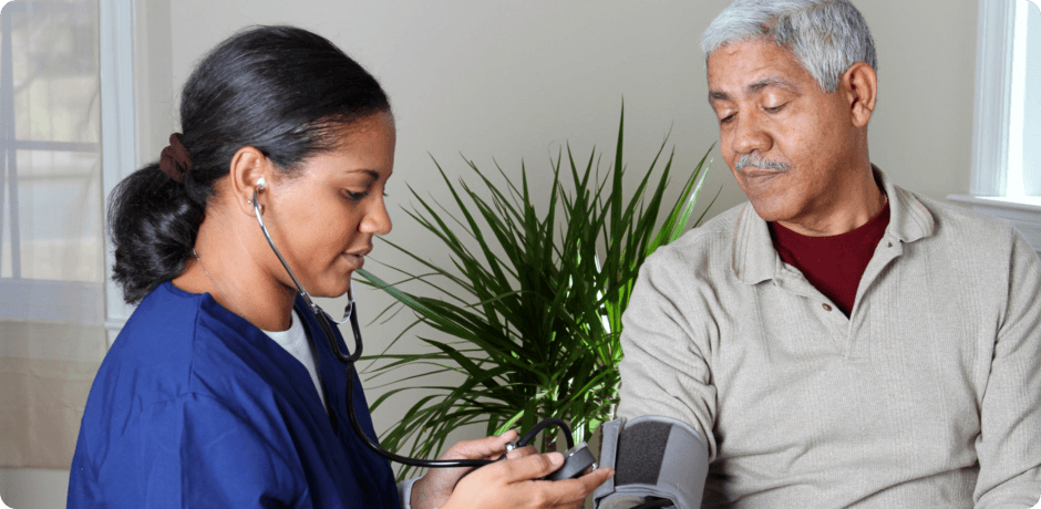 an old man doing blood pressure check