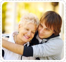 a young boy hug an old woman